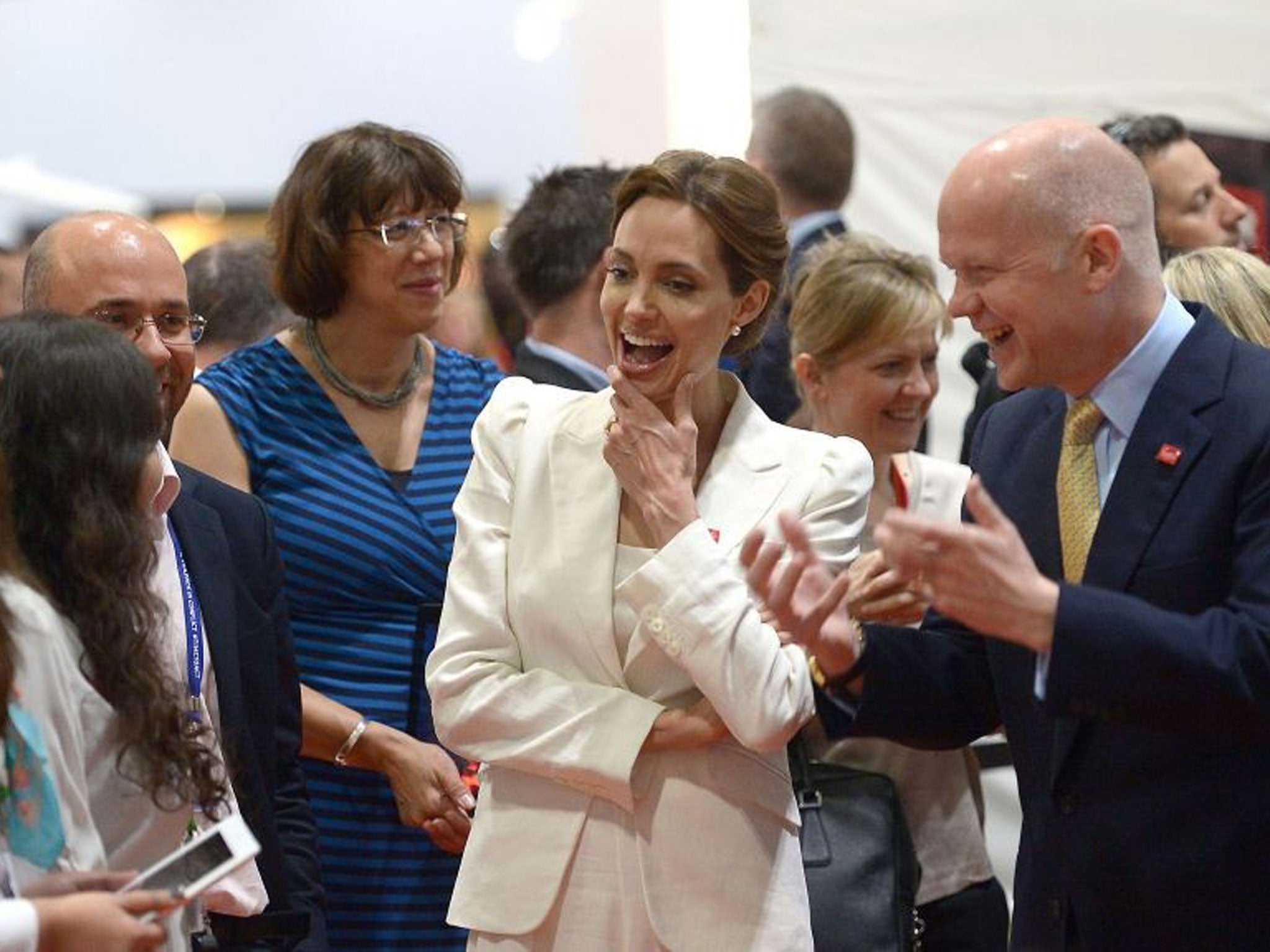 Summit co-hosts William Hague and US actress and Angelina Jolie visit exhibitors during the first day of the Global Summit to End Sexual Violence in Conflict