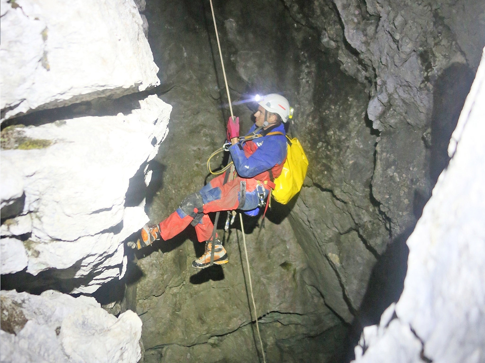 A rescuer enters a cave near Berchtesgaden, Germany