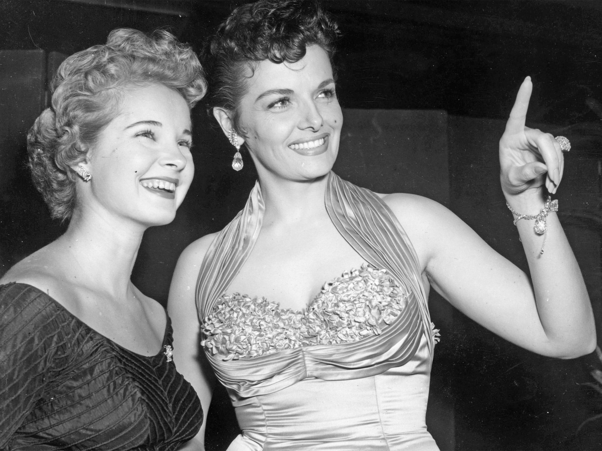 Freeman, left, with Jane Russell, in London’s Leicester Square for the 1954 Royal Film Performance, which that year was ‘Beau Brummell’