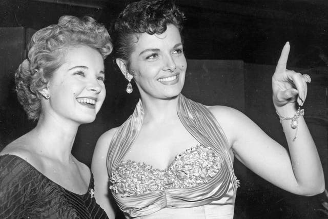 Freeman, left, with Jane Russell, in London’s Leicester Square for the 1954 Royal Film Performance, which that year was ‘Beau Brummell’ 