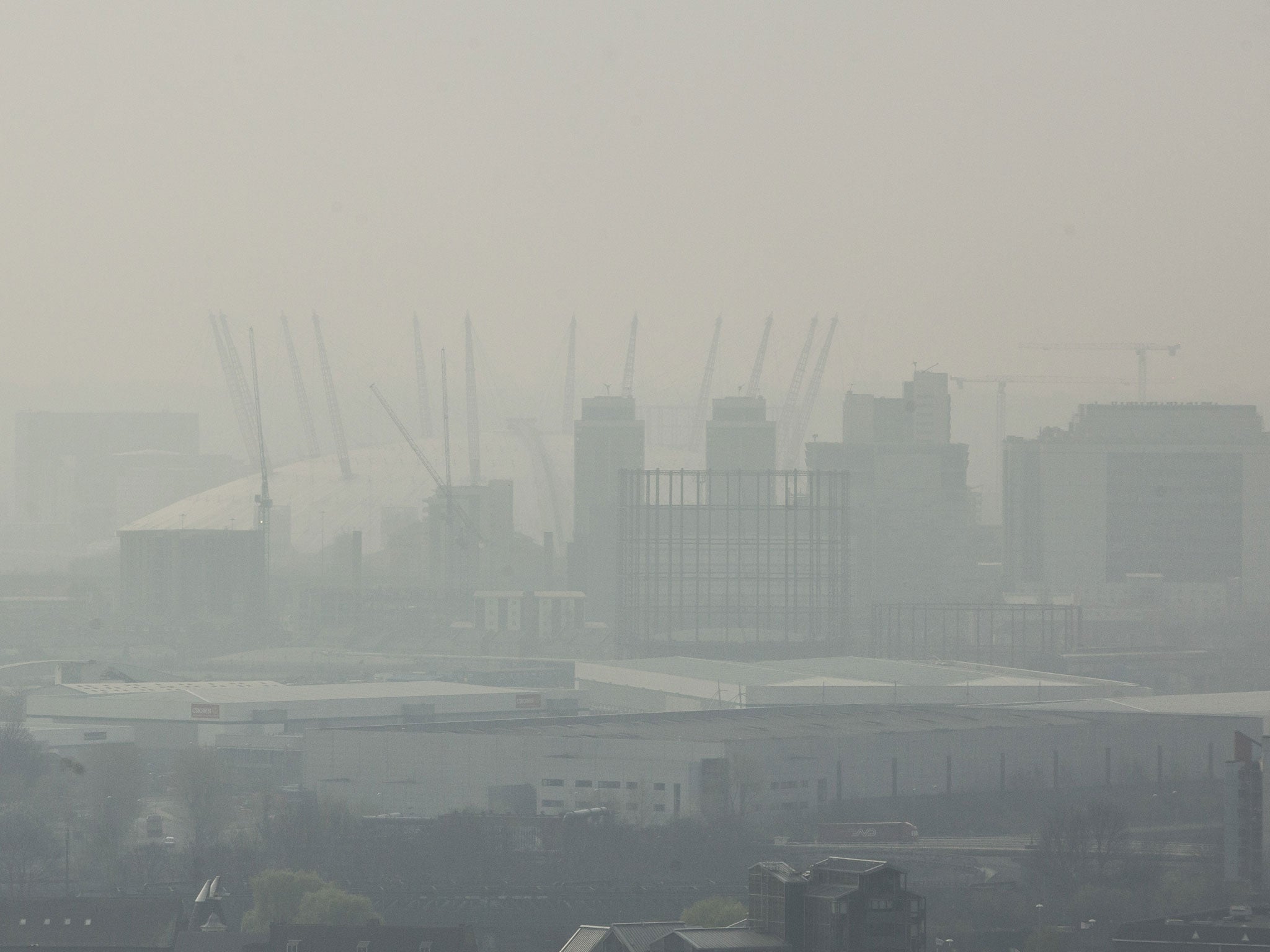 A view of the 02 Arena through smog on April 2, 2014, when dust from the Sahara combined with pollution from mainland Europe to create one of the worst smogs of the year