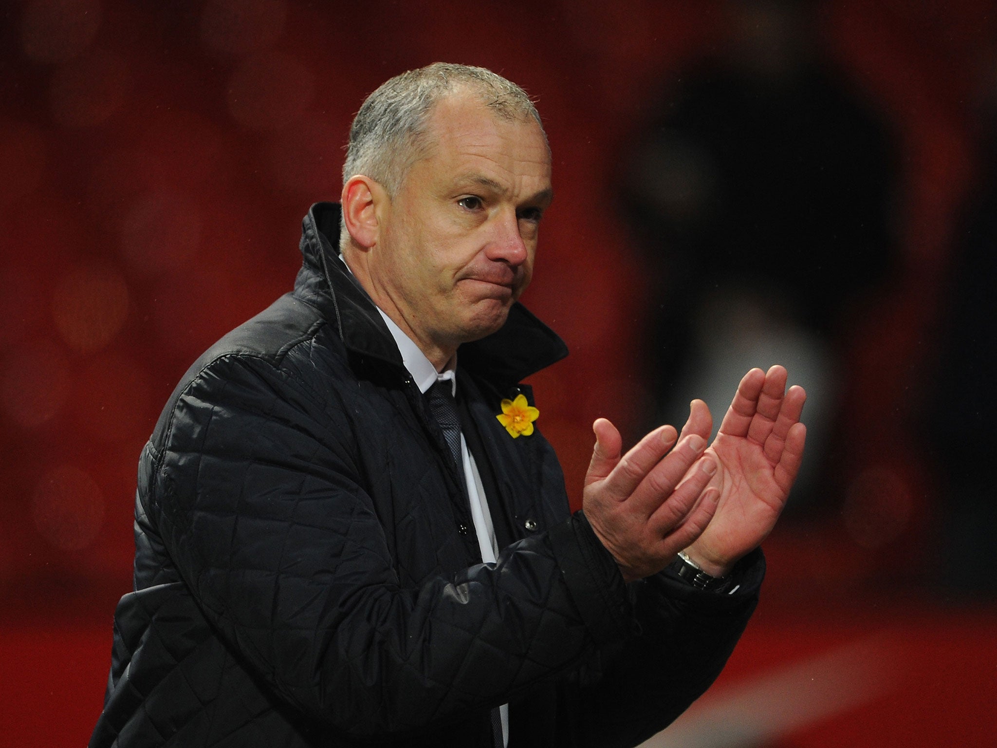 Reading Caretaker Manager Eamonn Dolan applauds the fans at the end of the Barclays Premier League match between Manchester United and Reading