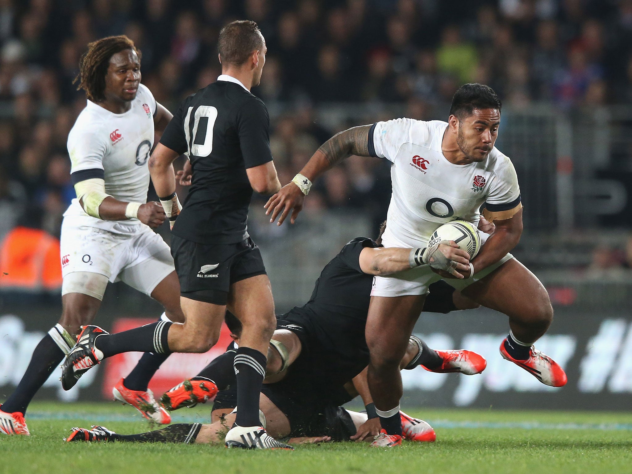 Manu Tuilagi breaks through the New Zealand defence during England's narrow 20-15 defeat