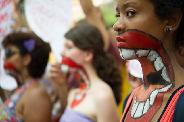 Women protest against domestic violence in Brazil