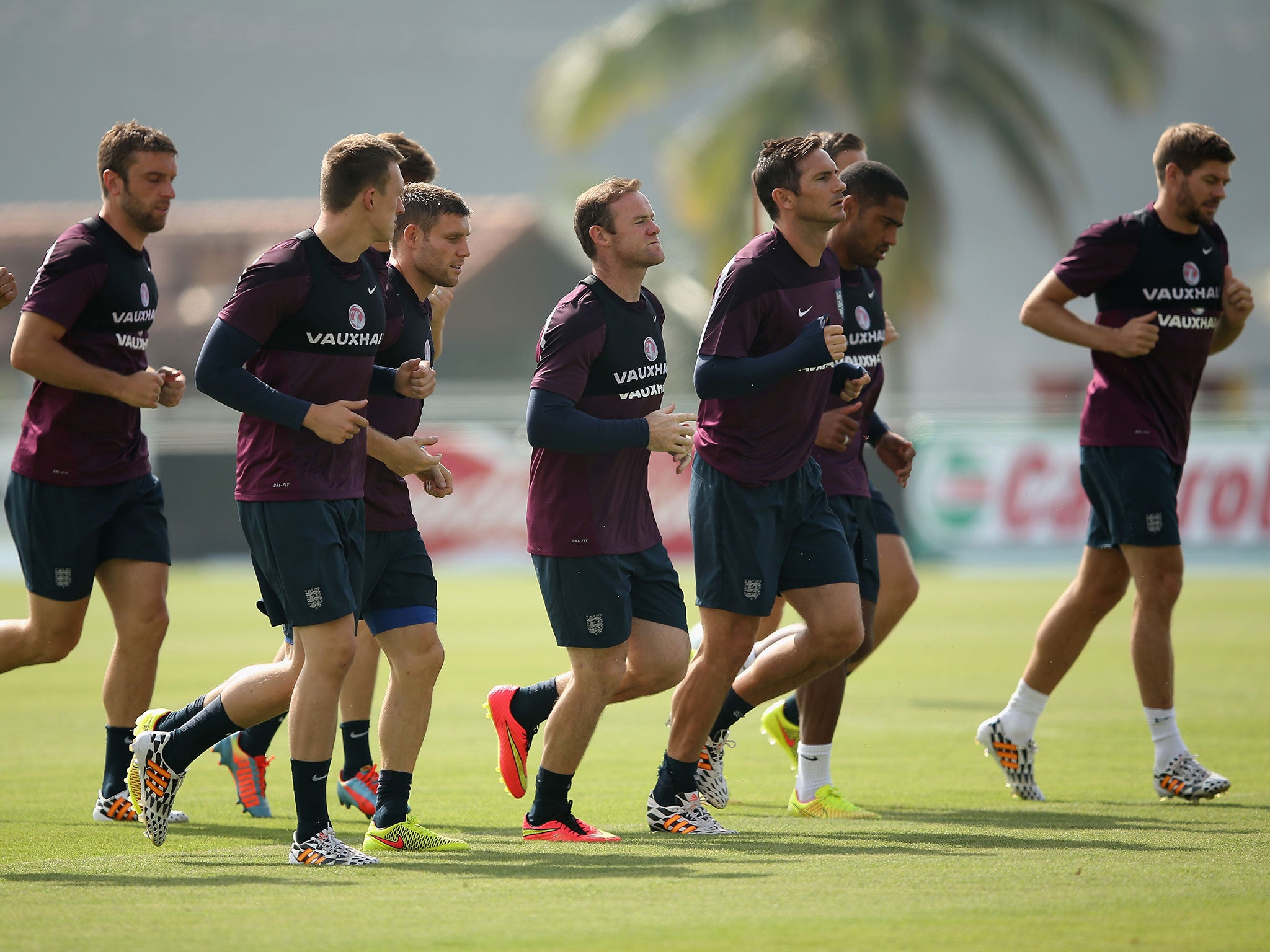 Wayne Rooney and Frank Lampard of England run with team mates during a training session at the Urca military base on June 11, 2014 in Rio de Janeiro, Brazil.
