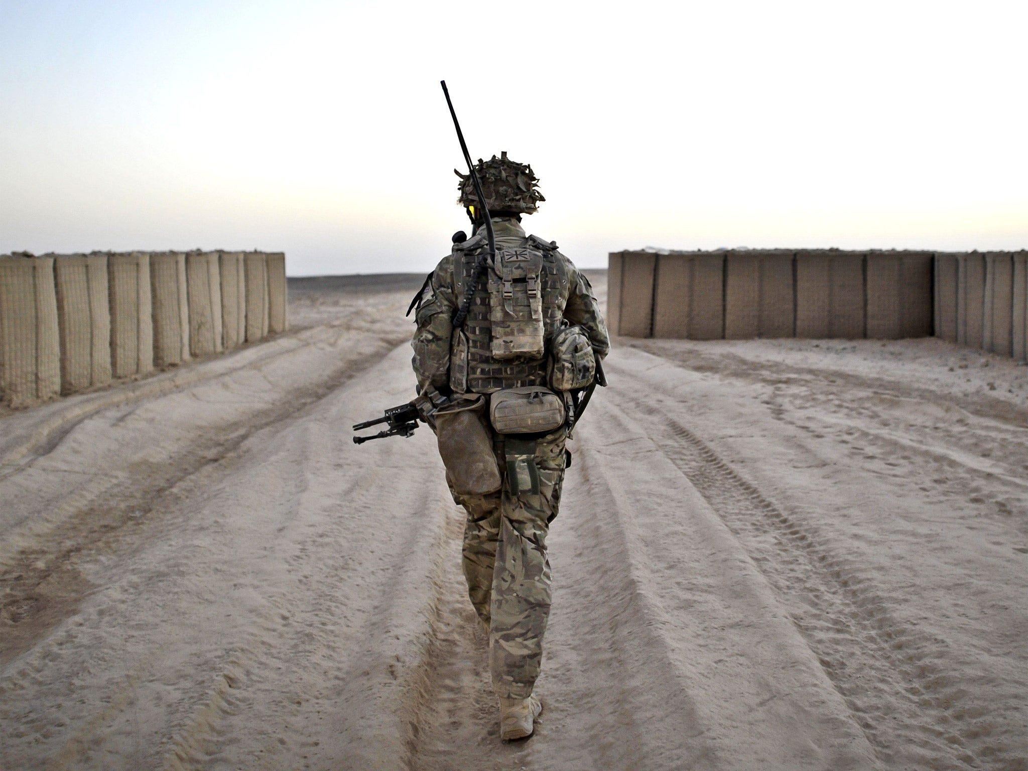 A soldier conducting a dawn foot patrol in Helmand Province, Afghanistan