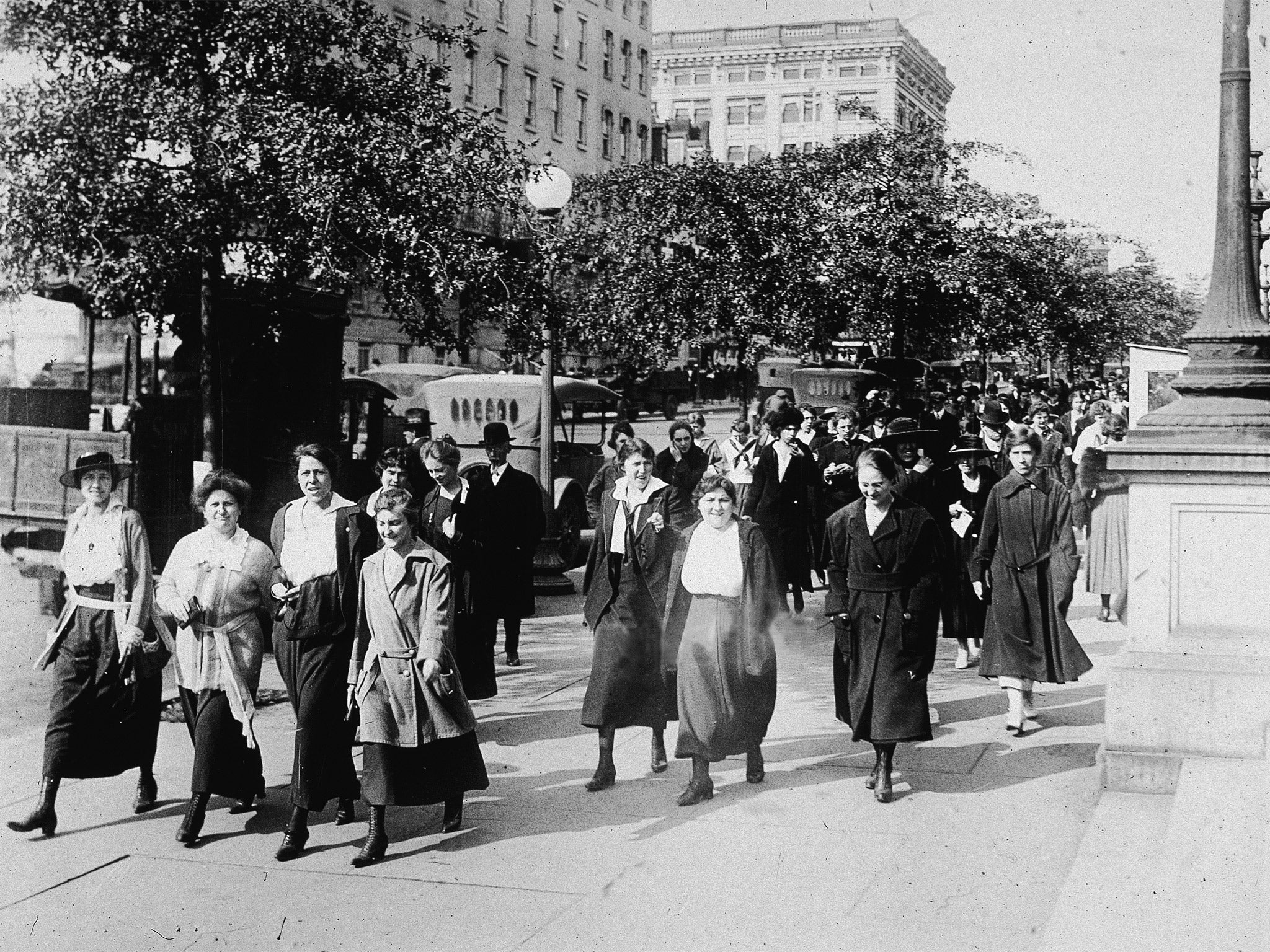 Women from the Department of War took 15-minute walks to breathe in fresh air to ward off the influenza virus during World War I