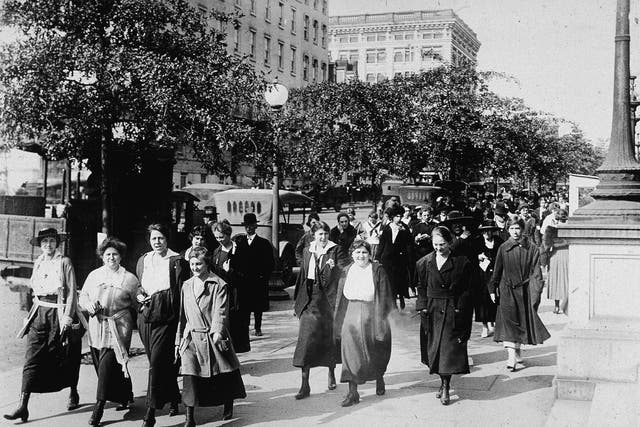 Women from the Department of War took 15-minute walks to breathe in fresh air to ward off the influenza virus during World War I