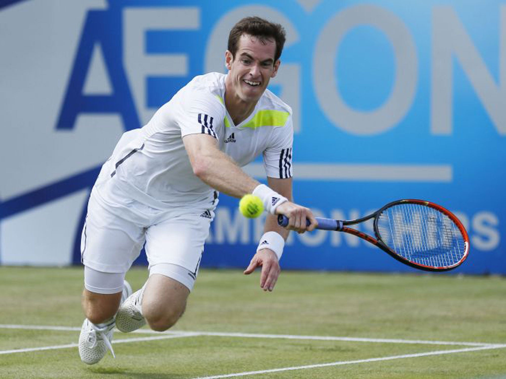 Andy Murray diving to make a shot on his way to a straight-sets victory over the Frenchman, Paul-Henri Mathieu (PA)