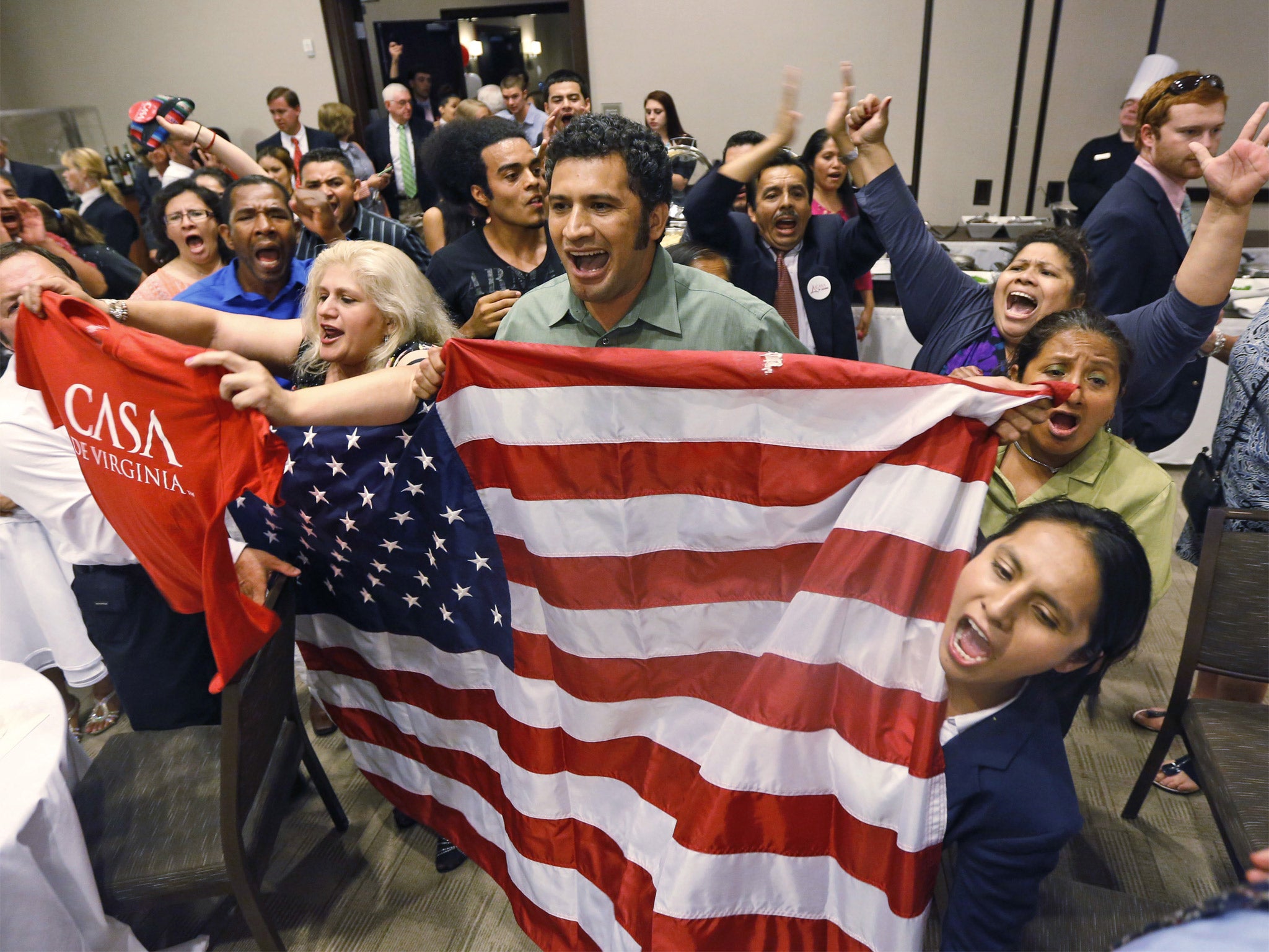 Immigration reform supporters celebrate the result