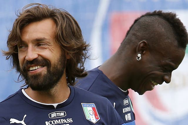 Andrea Pirlo (left) and Mario Balotelli share a joke in training as they prepare to face England