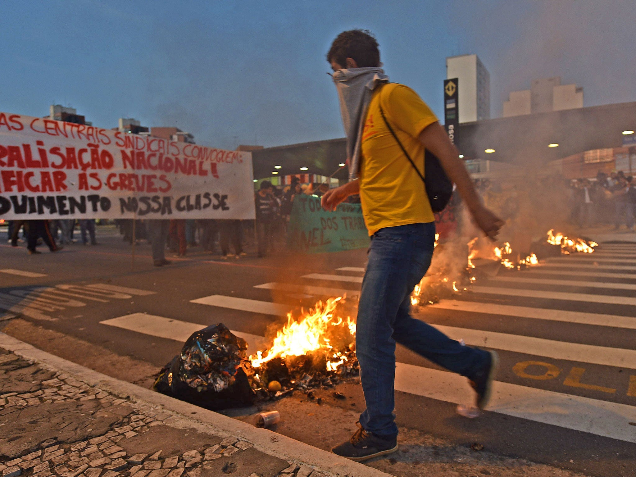 Striking subway workers and members of the MTST (Homeless Workers' Movement), demonstrate on June 9, 2014 in Sao Paulo