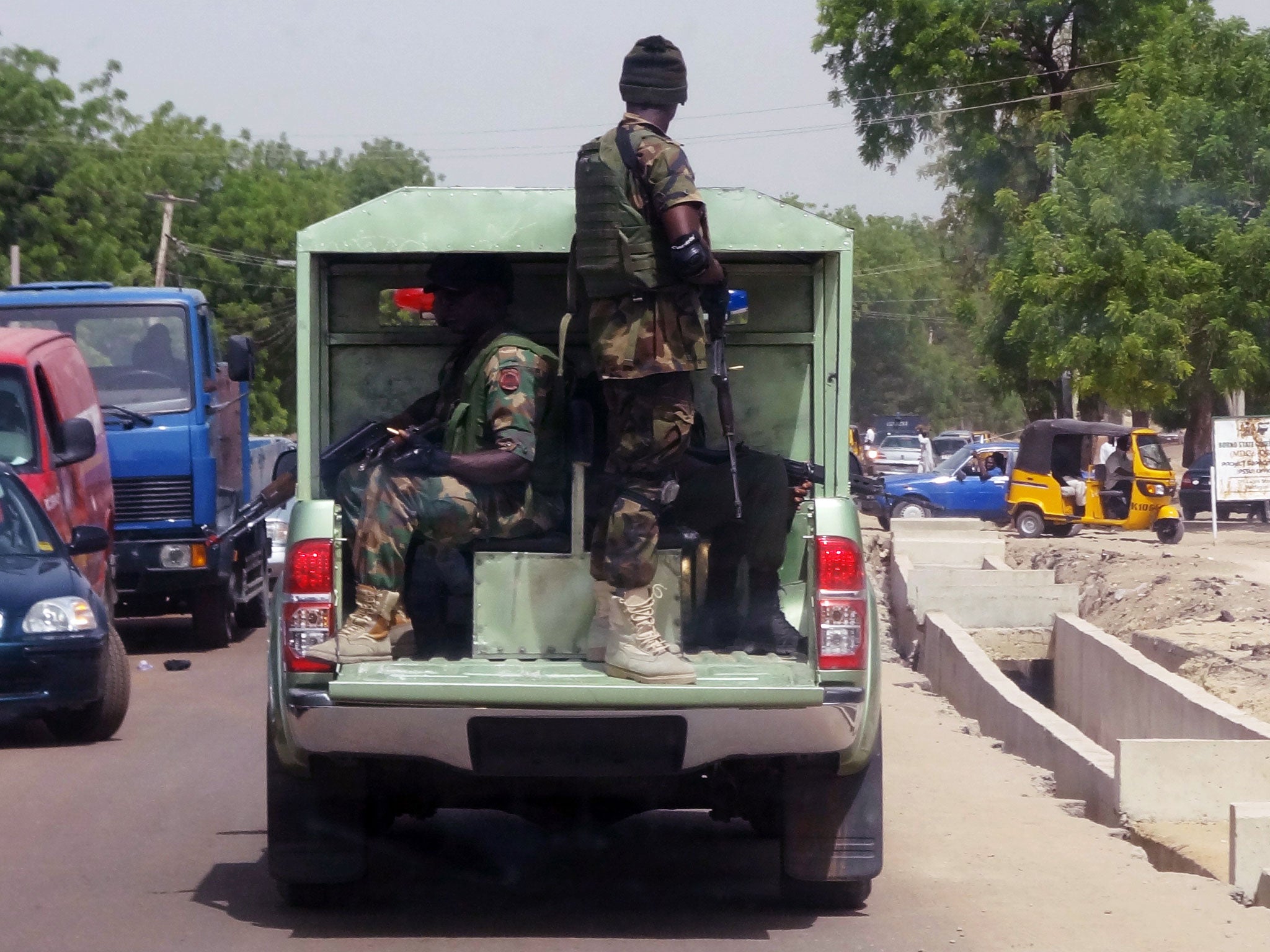 Nigerian army soldiers patrol the streets of Maiduguri, capital of the Borno state, on 24 May, 2013 (AFP)