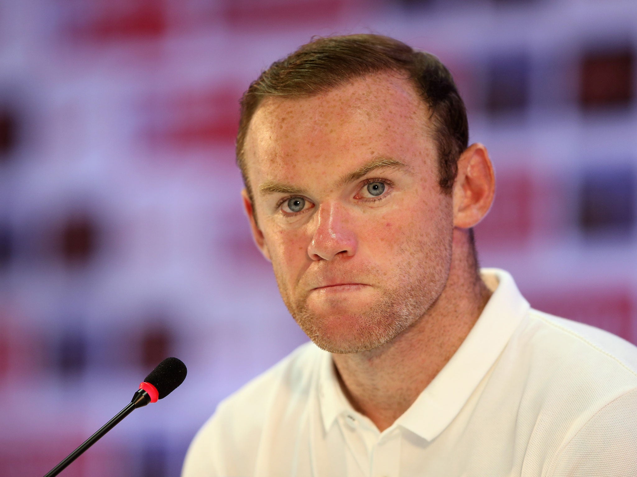 Wayne Rooney of England looks on during a press conference