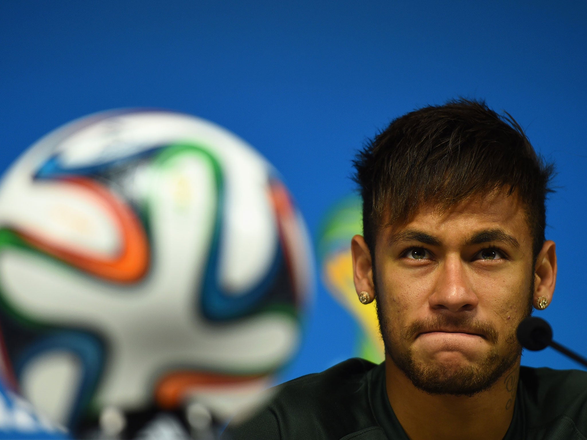 Neymar of Brazil looks on during a Brazil press conference ahead of the 2014 FIFA World Cup Brazil opening match against Croatia at Arena de Sao Paulo in Brazil.
