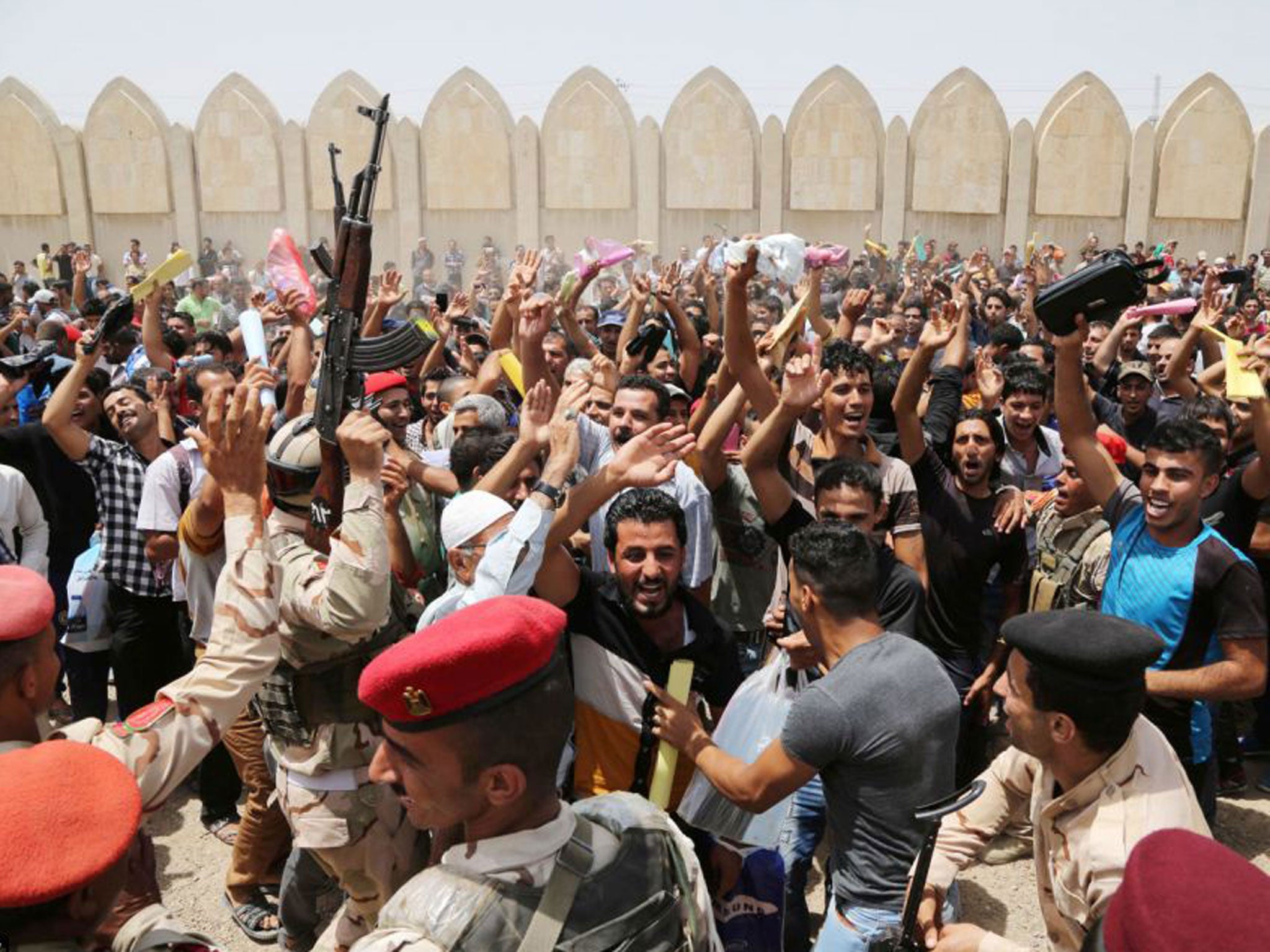 Hundreds of men turned up at an army recruitment centre to volunteer for the military service to protect Baghdad