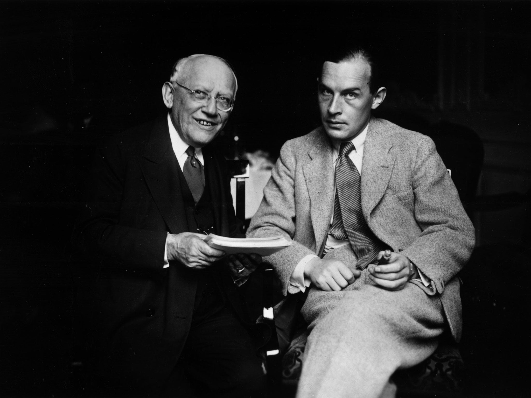 Erich Maria Remarque (1898-1970), whose 1929 novel, ‘All Quiet On The Western Front’, was based on his wartime experiences. Here he isseen with Carl Laemmle of Universal Pictures (left)