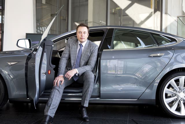 Tesla founder Elon Musk with a Model S