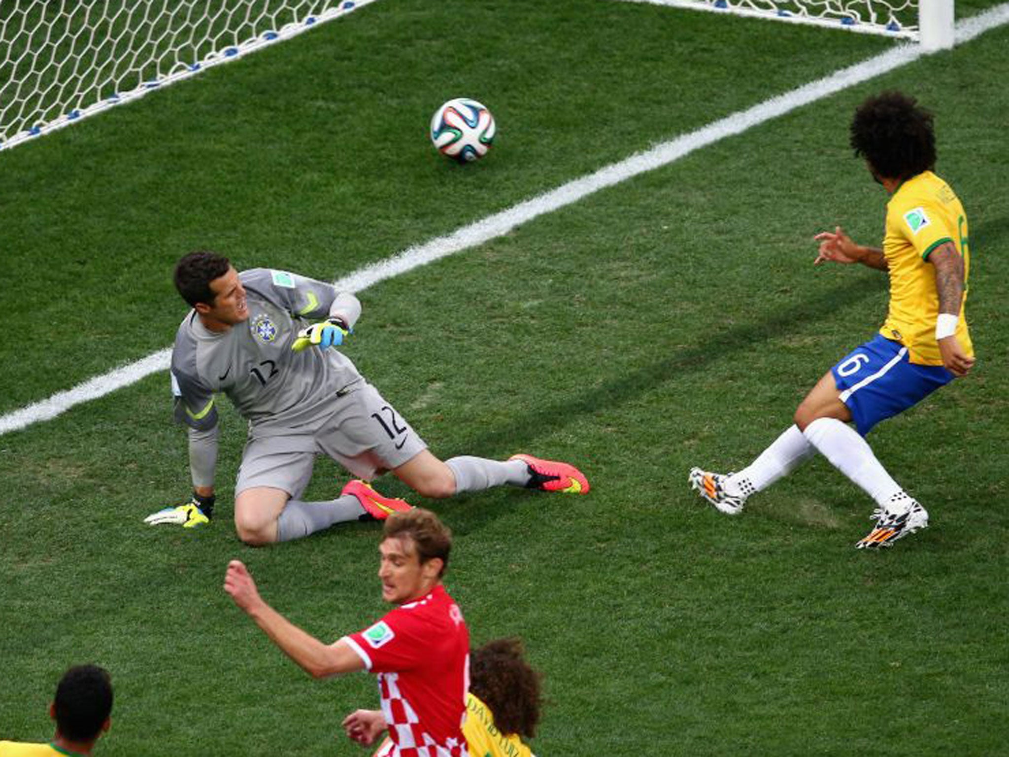 Marcelo deflects the ball past Julio Cesar to open the scoring for Croatia