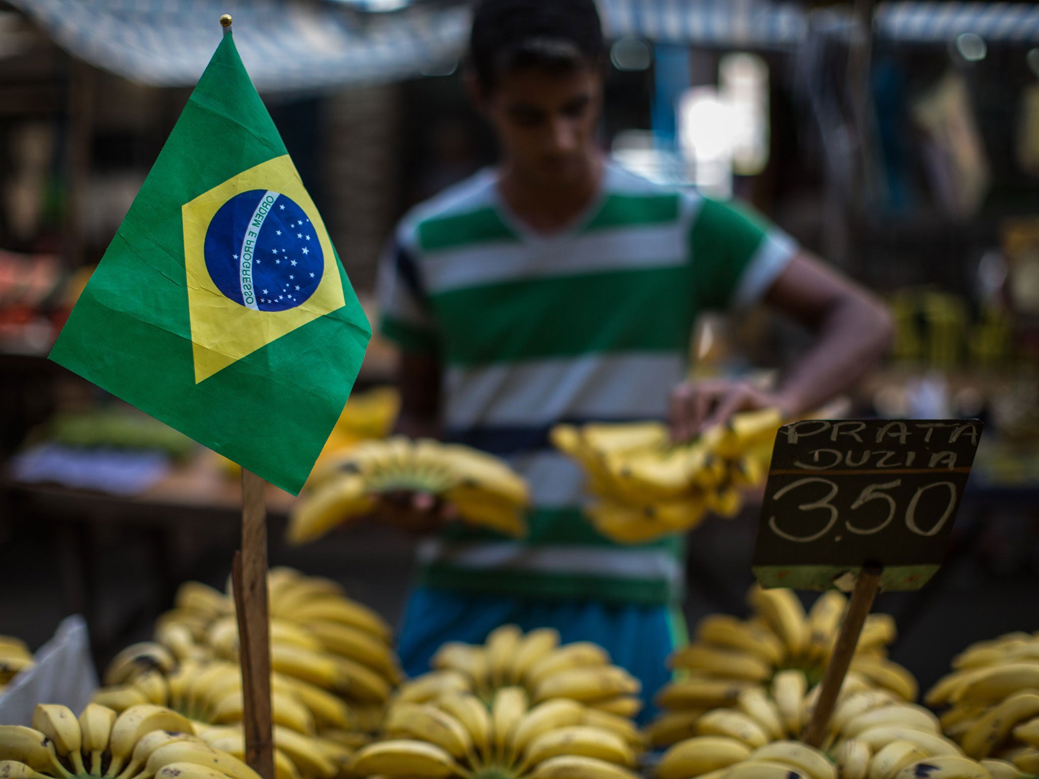 A stallholder sells bananas at Mare complex shantytown (favela) in Rio de Janeiro, Brazil, on June 7, 2014, five days before the start of the FIFA World Cup