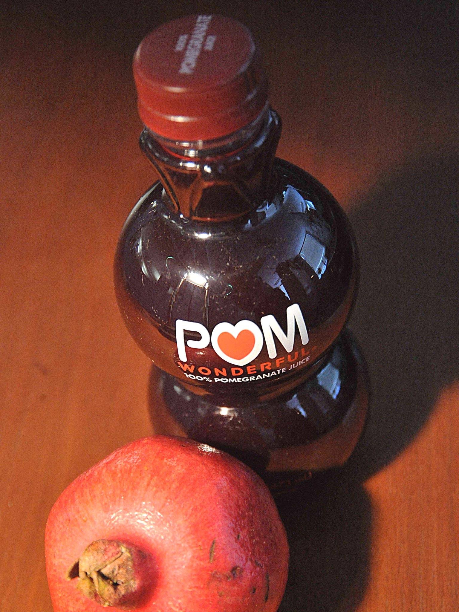 Supreme Court justices have allowed pomegranate growers POM Wonderful to proceed with a lawsuit against Coca-Cola Co