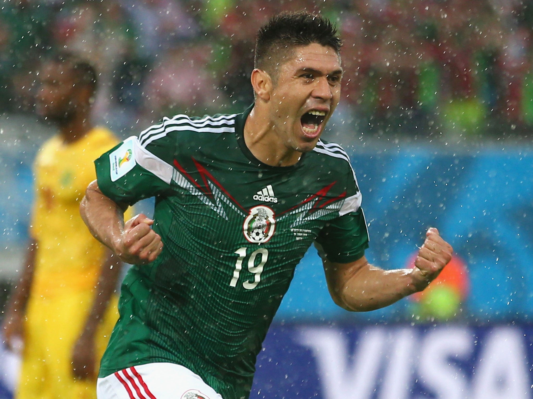Oribe Peralta celebrates his goal for Mexico against Cameroon
