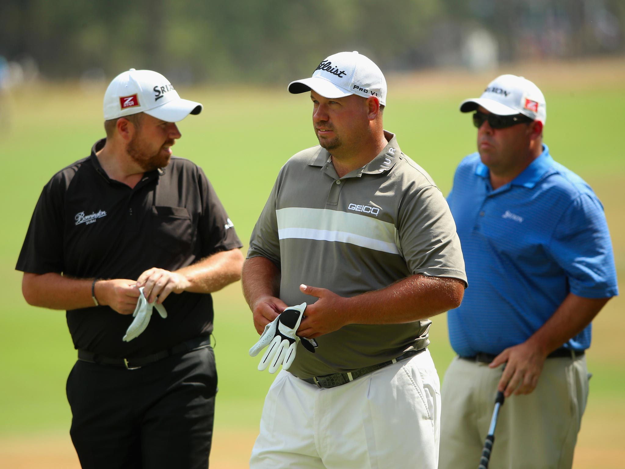 From left to right: Shane Lowry, of Ireland, Zimbabwe’s
Brendon de Jonge and Kevin Stadler, of the United States