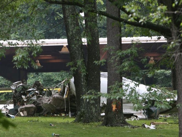 The plane wreckage sits in the yard of a Purchase, NY