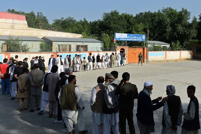 The Taliban have intensified attacks ahead of the vote and warned people to stay away from the polls, but only minor violence was reported by midday