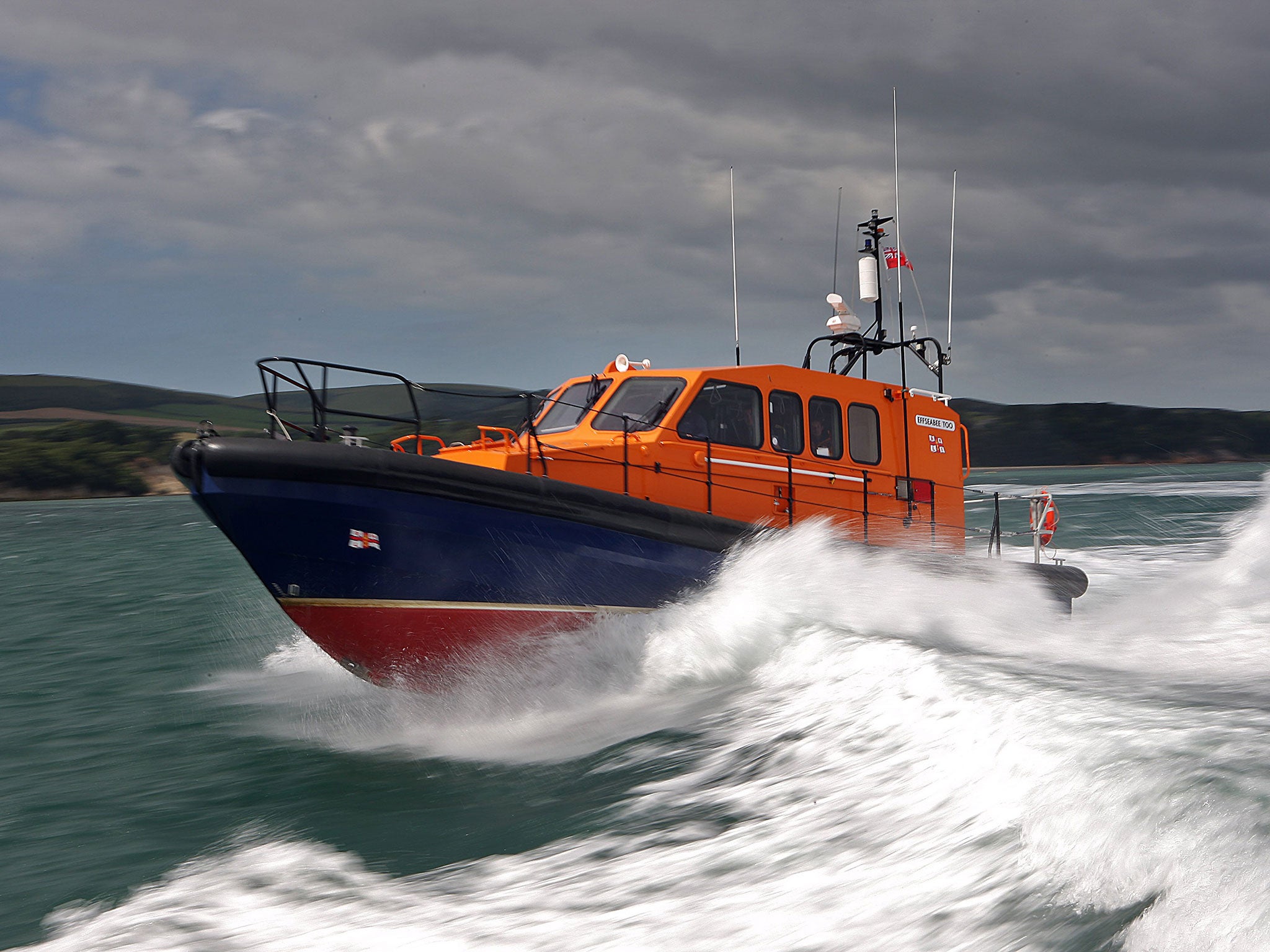 Lifeboat crews rescued one of the men pulled under the ferry
