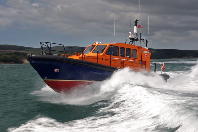 Lifeboat crews rescued one of the men pulled under the ferry
