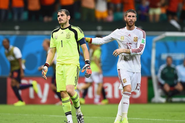 Iker Casillas is consoled by Sergio Ramos after conceding in the 5-1 defeat to the Netherlands