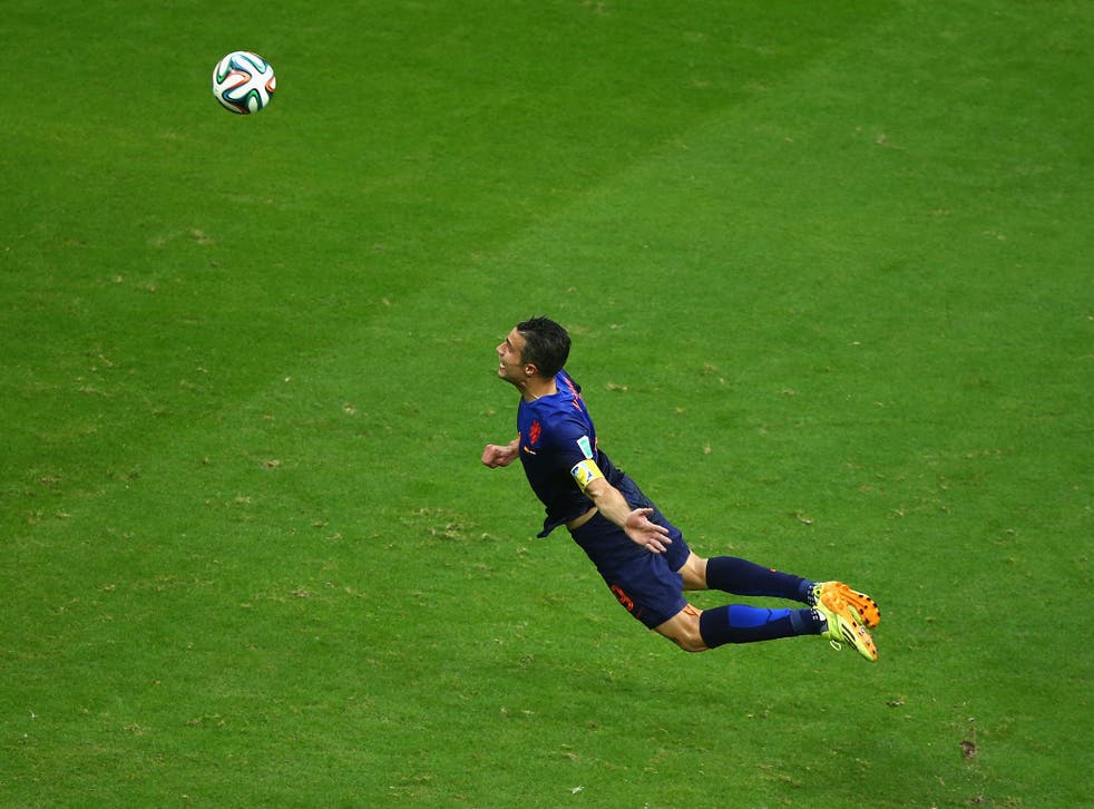 Robin van Persie scores a header in the Netherlands' 5-1 victory over Spain