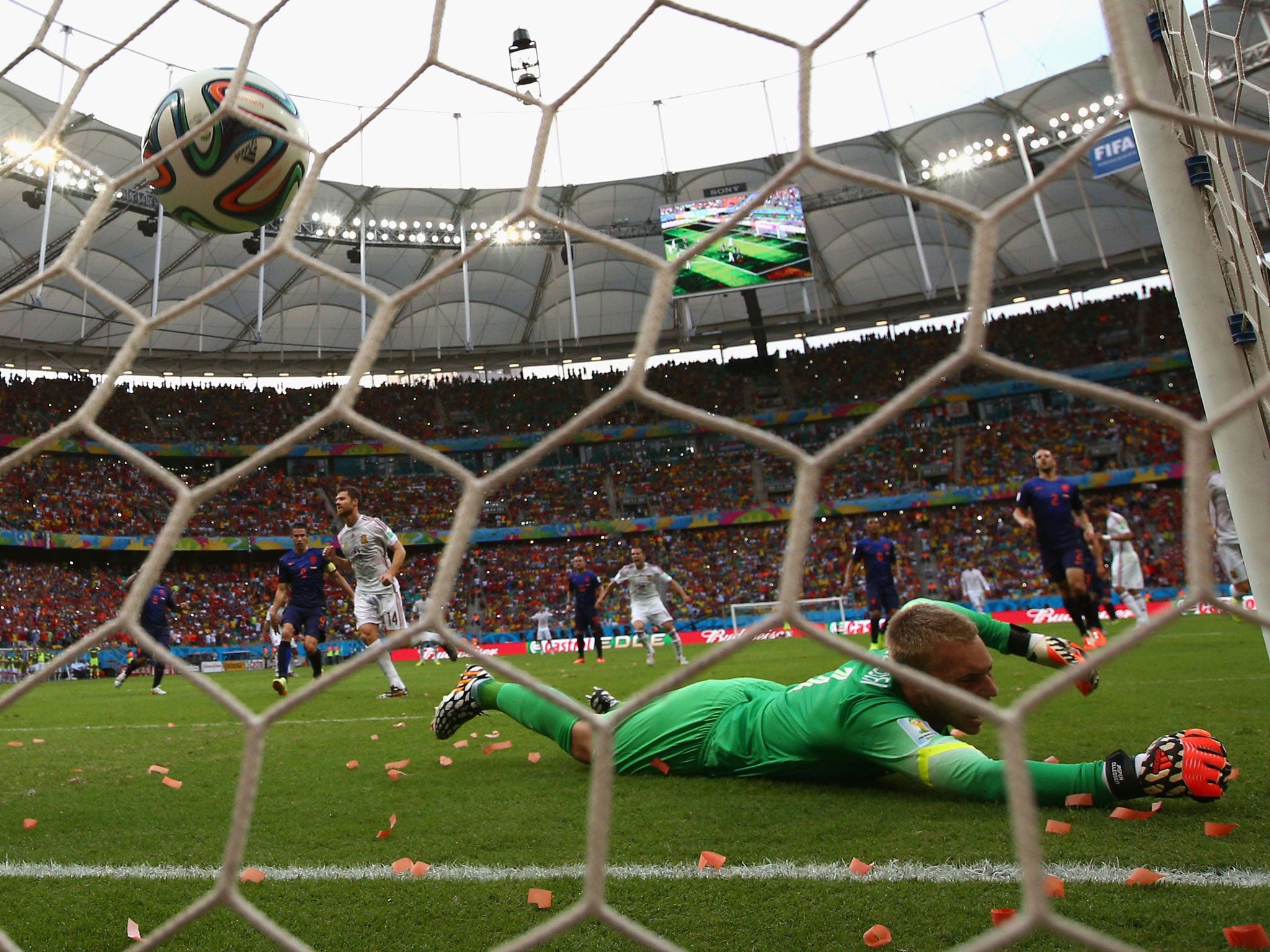 Xabi Alonso of Spain shoots and scores from the penalty spot