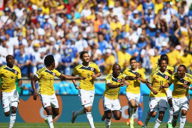 Pablo Armero celebrates after giving Colombia the lead against Greece