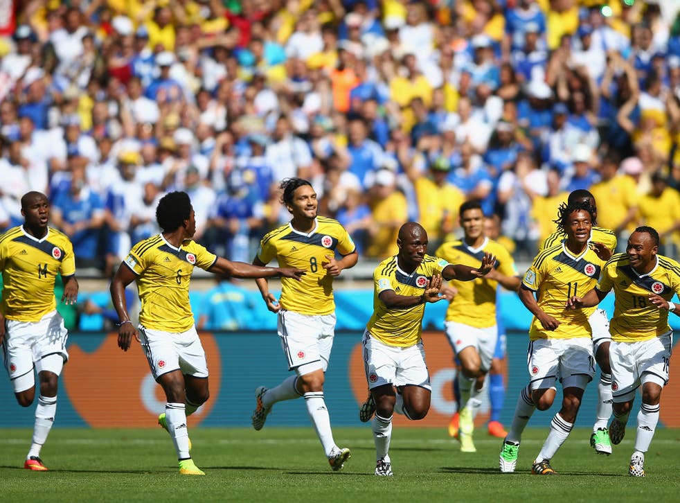 Pablo Armero celebrates after giving Colombia the lead against Greece