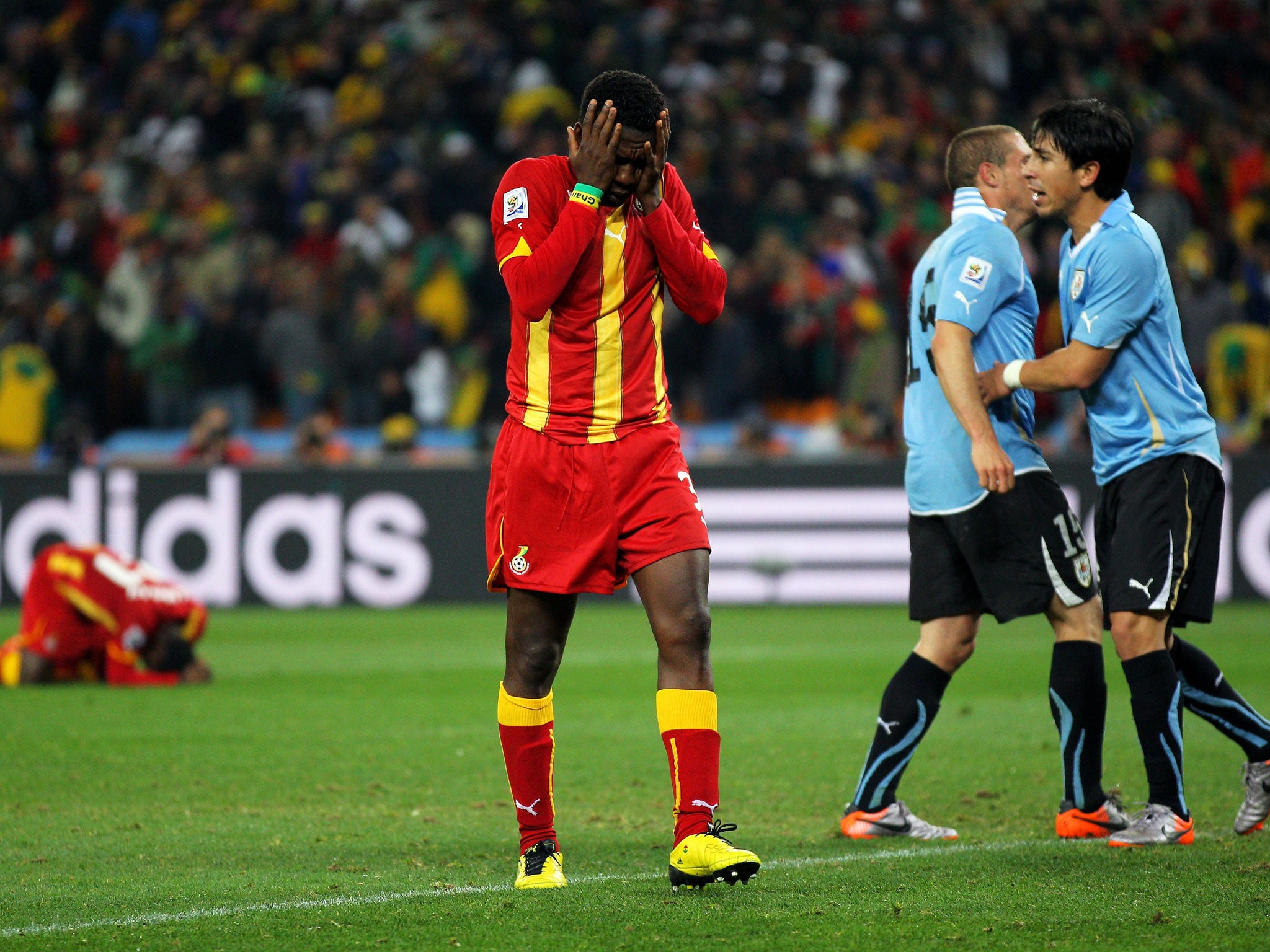 Asamoah Gyan of Ghana reacts as he misses a late penalty
