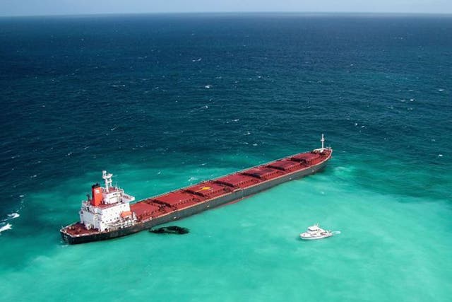 Dirty business: A grounded coal carrier leaks oil on the Great Barrier Reef in 2010