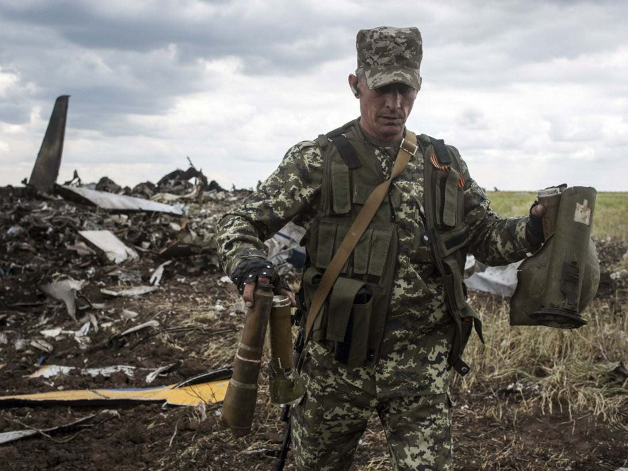 A pro-Russian fighter with remnants of the Ukrainian plane shot down