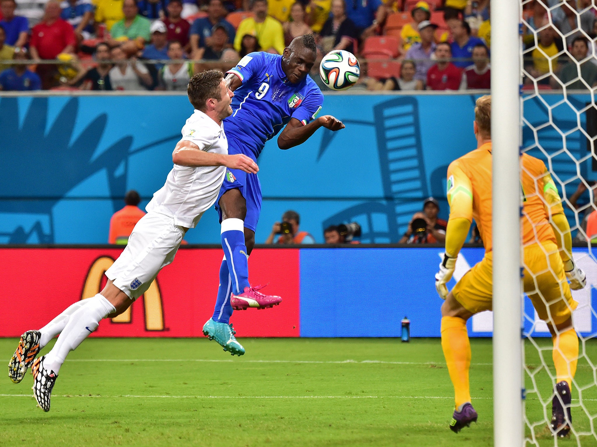 Mario Balotelli heads Italy in front against England at the World Cup