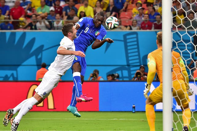 Mario Balotelli heads Italy in front