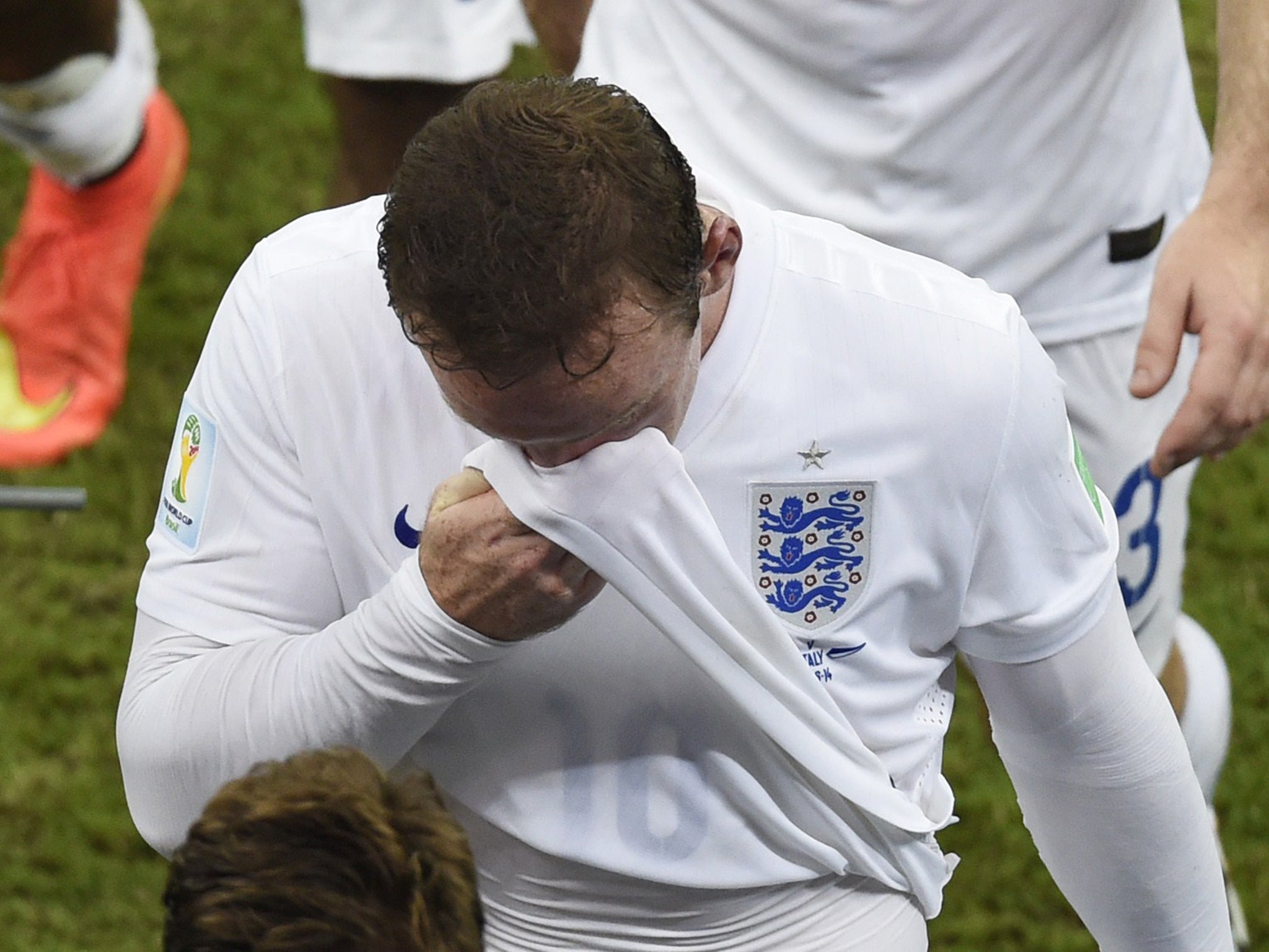 Wayne Rooney leaves the field following defeat for England