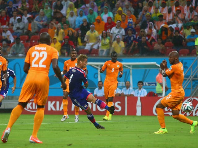 Keisuke Honda scores the opener for Japan with a powerful left-footed strike