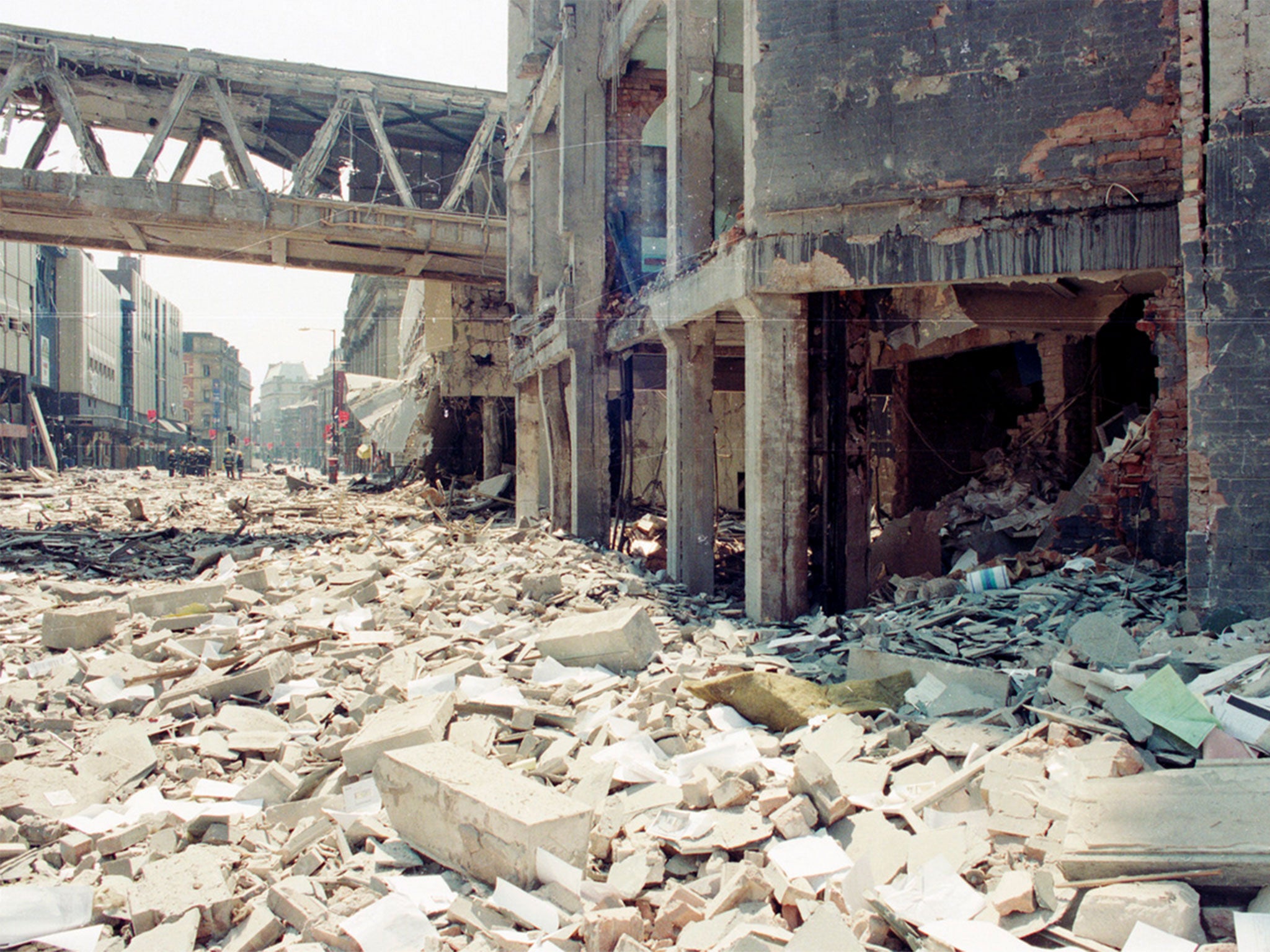 Firemen solemnly carry on with the task of sifting through the rubble. Miraculously, no one was killed in the blast.