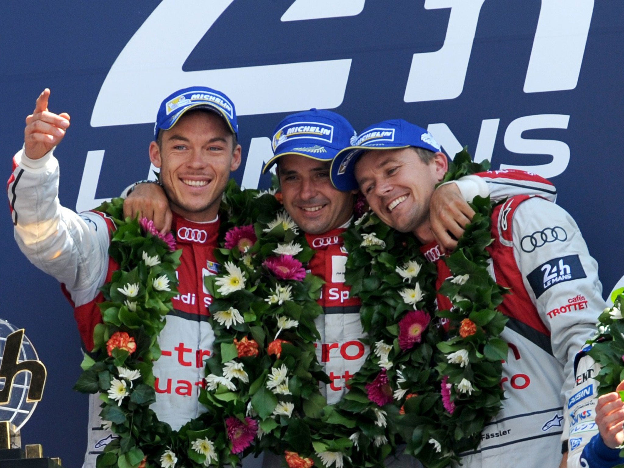 Andre Lotterer, Benoit Treluyer and Marcel Fassler (left to right) celebrate their win