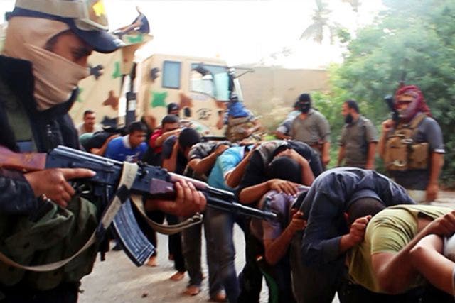 An image posted on a militant website appears to show Isis fighters leading away captured Iraqi soldiers for execution in Tikrit