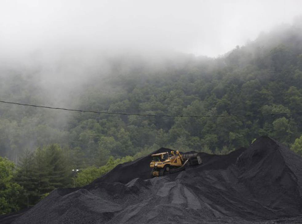 A bulldozer operates atop a coal mound at the CCI Energy Slones Branch Terminal in Shelbiana, Kentucky