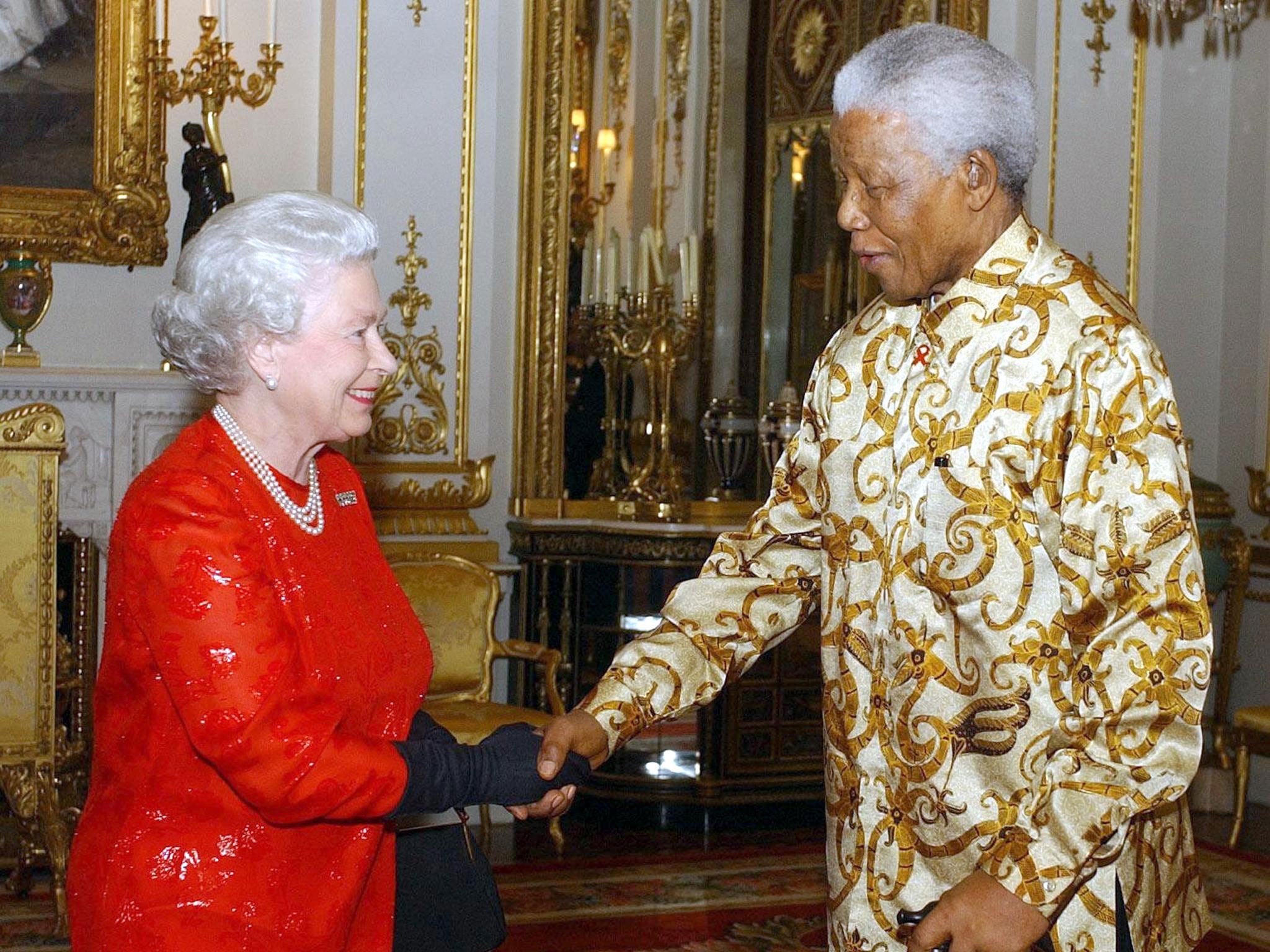 Queen Elizabeth II meets with former South African President, Nelson Mandela during a reception at Buckingham Palace, London, on 20 October, 2003