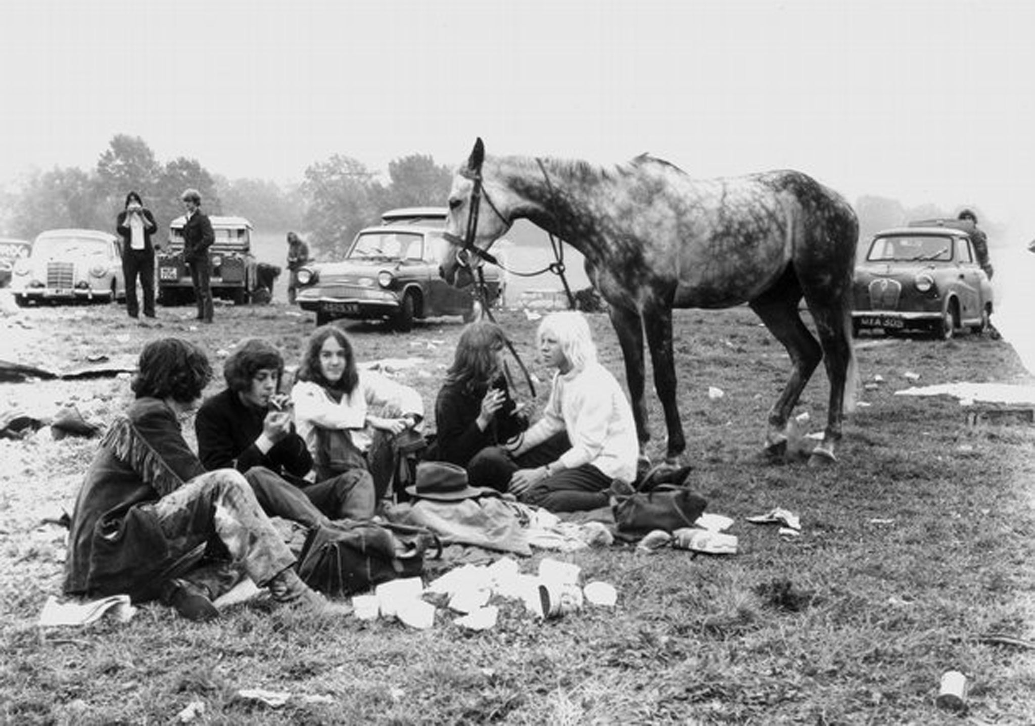 Festival goers enjoy the sunset in a photo to be kept in the V&A's Glastonbury archive