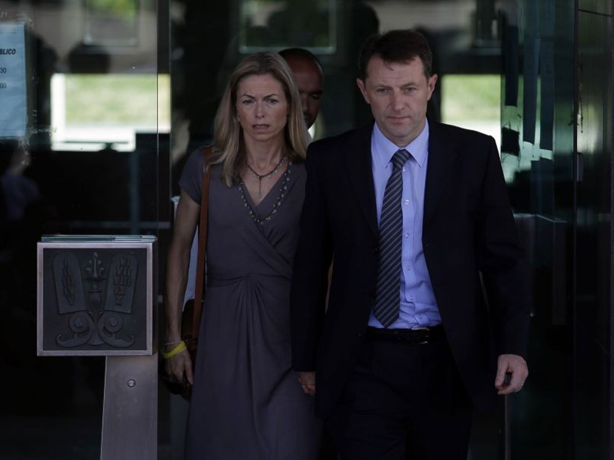 Kate, centre, and Gerry McCann, the parents of the missing British girl Madeleine McCann, leave a court in Lisbon